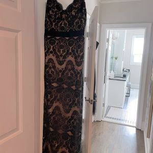 Catherine Dean size 8 formal dress with black lace over nude background.
